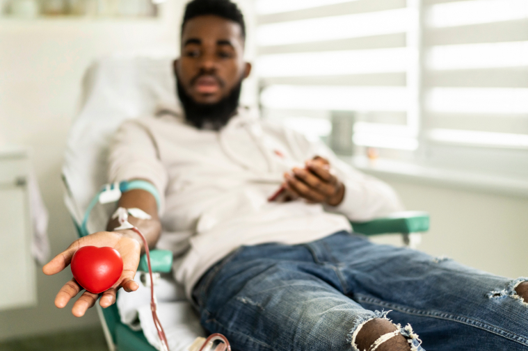 Donor giving blood at a donation center